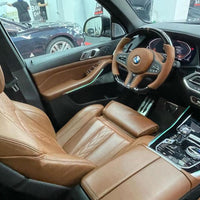 Customized Orange Leather Carbon Fiber Steering Wheel For BMW G Series and M5 in car view